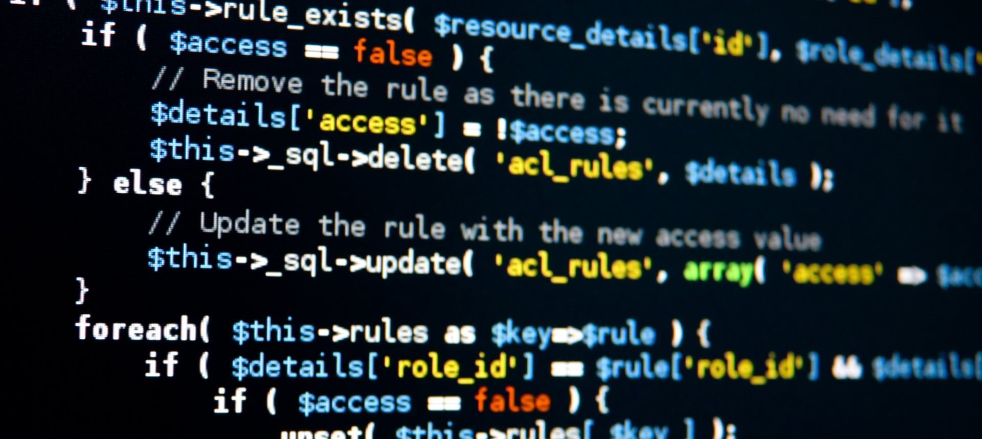 Commented program code on a dark screen, the kind of code engineers label for AI training