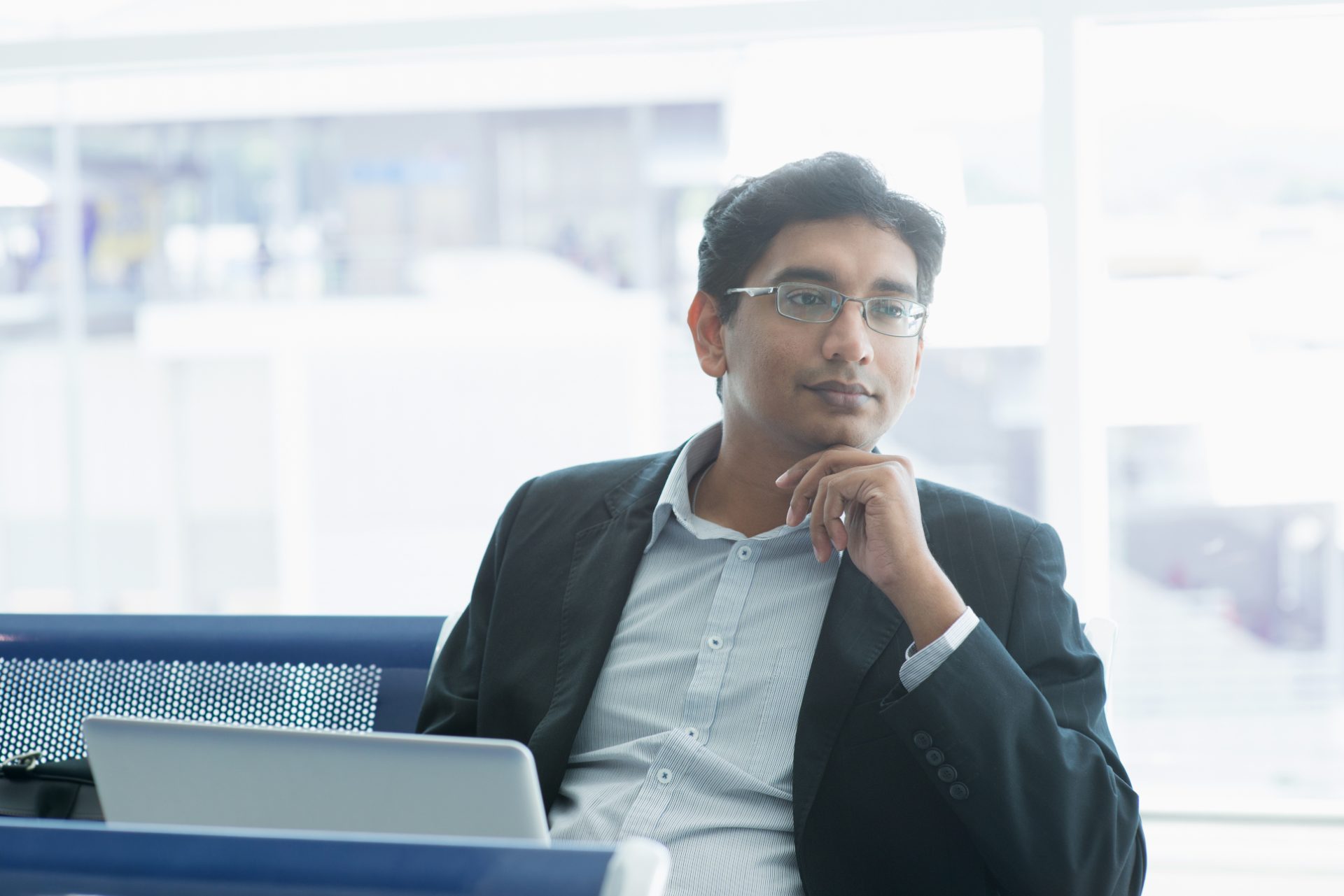 Accounts receivable analyst reviewing aging and cash application on his laptop, representing accounts receivable outsourcing to the Philippines