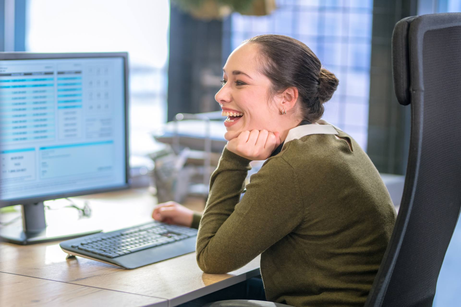 Back-office specialist processing records on a desktop monitor at a Philippine BPO