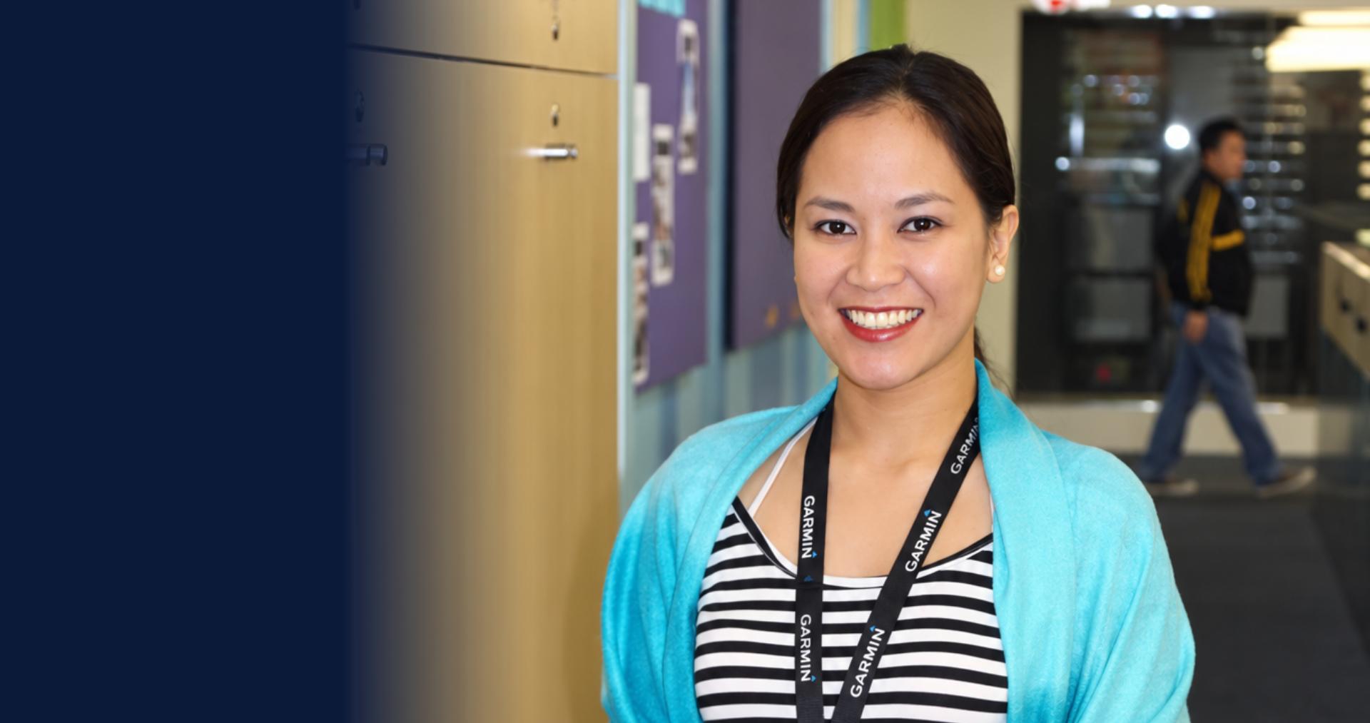 Smiling PITON-Global partner agent wearing a client ID lanyard in a Manila contact center, representing the Philippine BPO teams behind these case studies