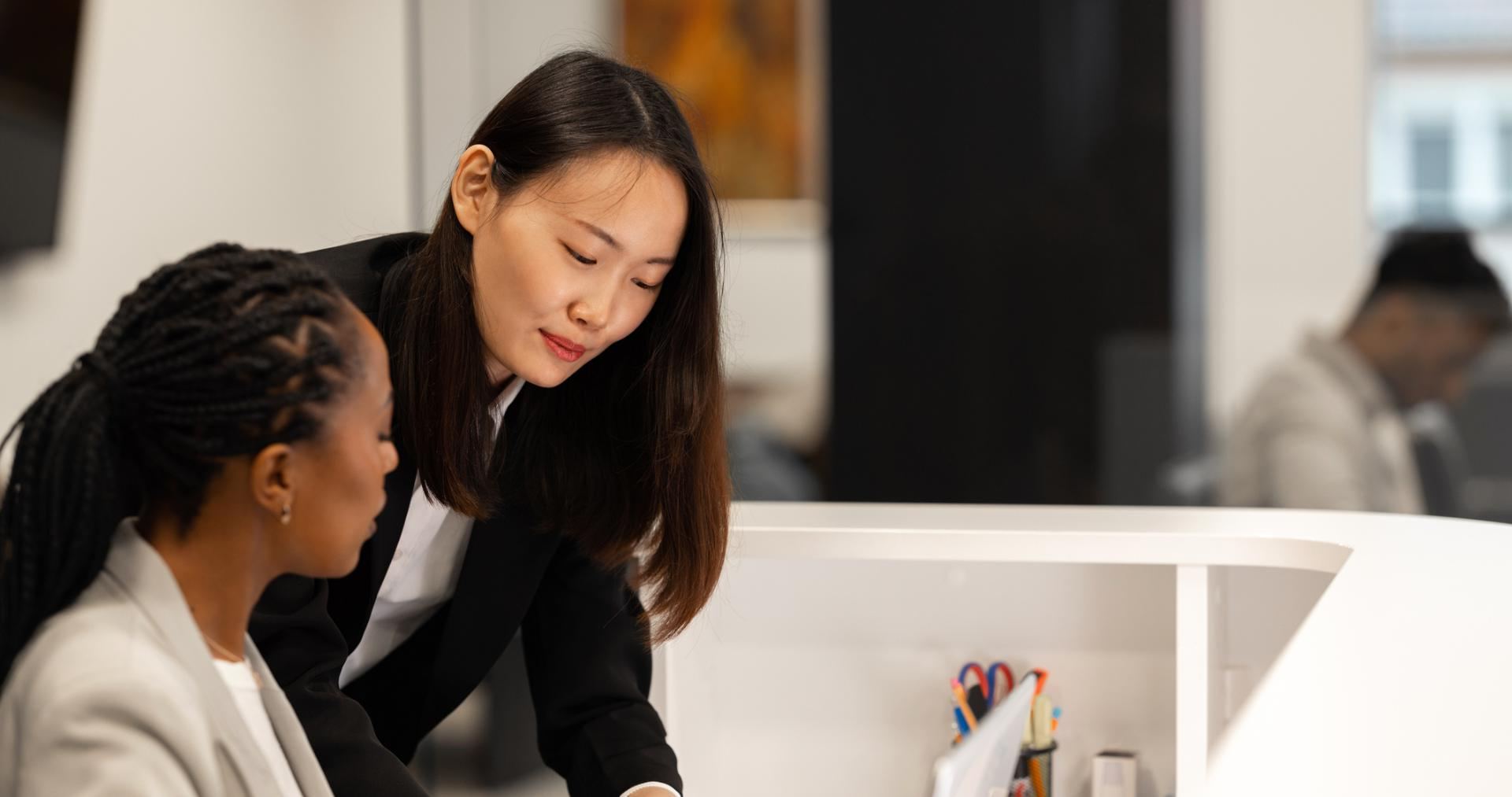 Two reviewers checking an AI-flagged item together before sign-off, for human AI verification