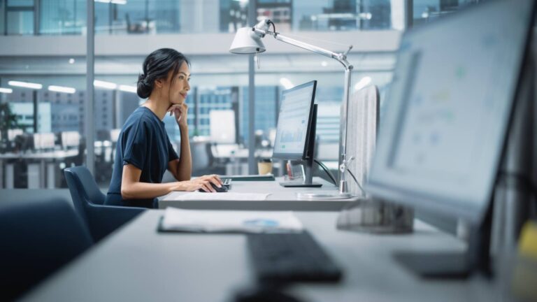 Data specialist analyzing charts on a monitor, for a post on web data extraction legal