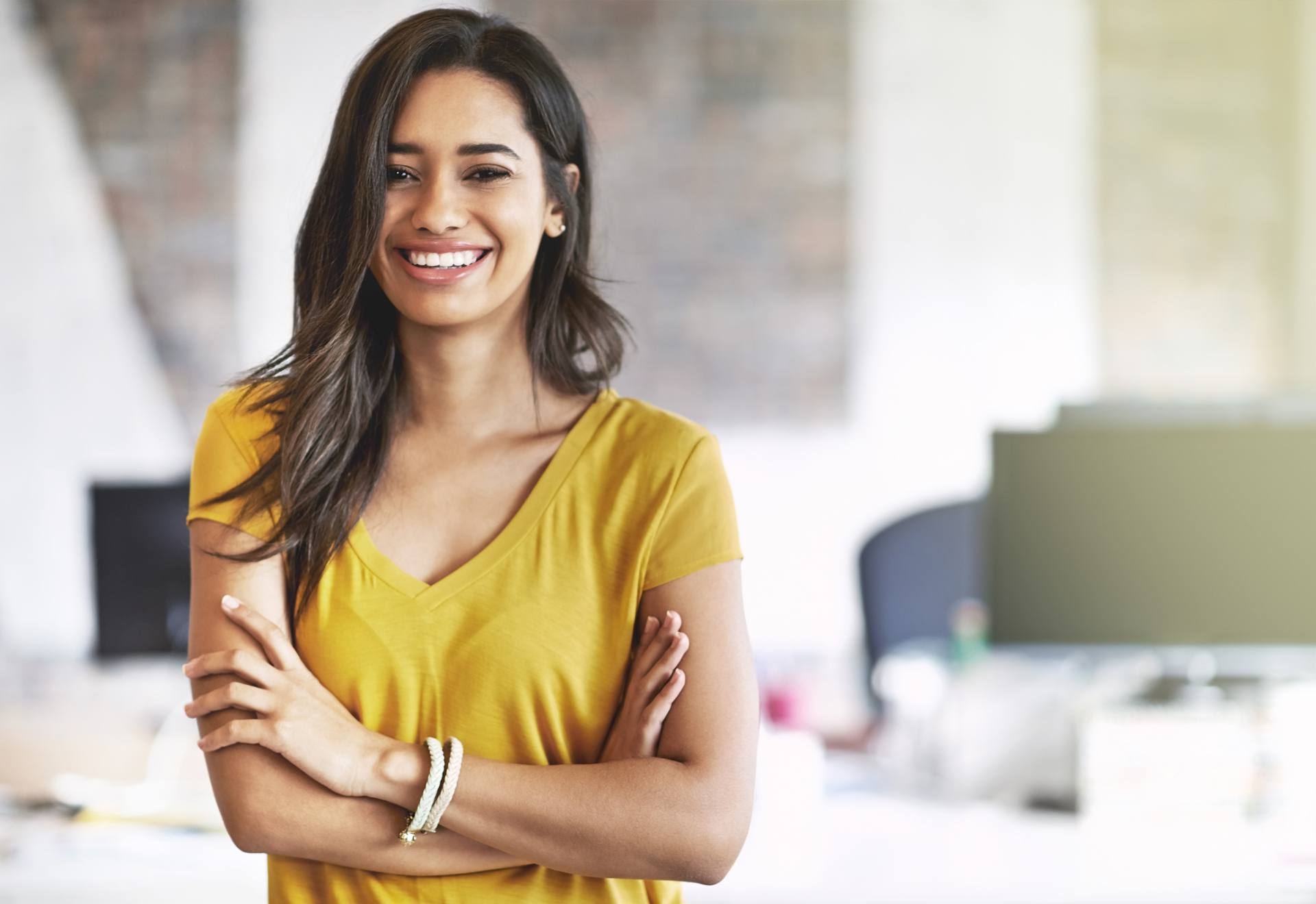 Smiling finance and accounting professional in a modern office, part of a CPA-led accounting team