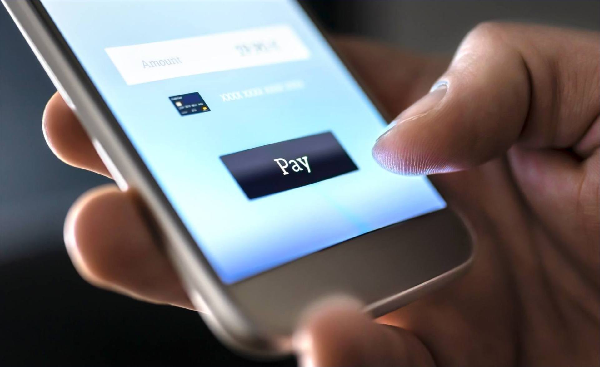 Customer completing a mobile payment on a smartphone app, representing fintech customer support by Philippine BPO teams