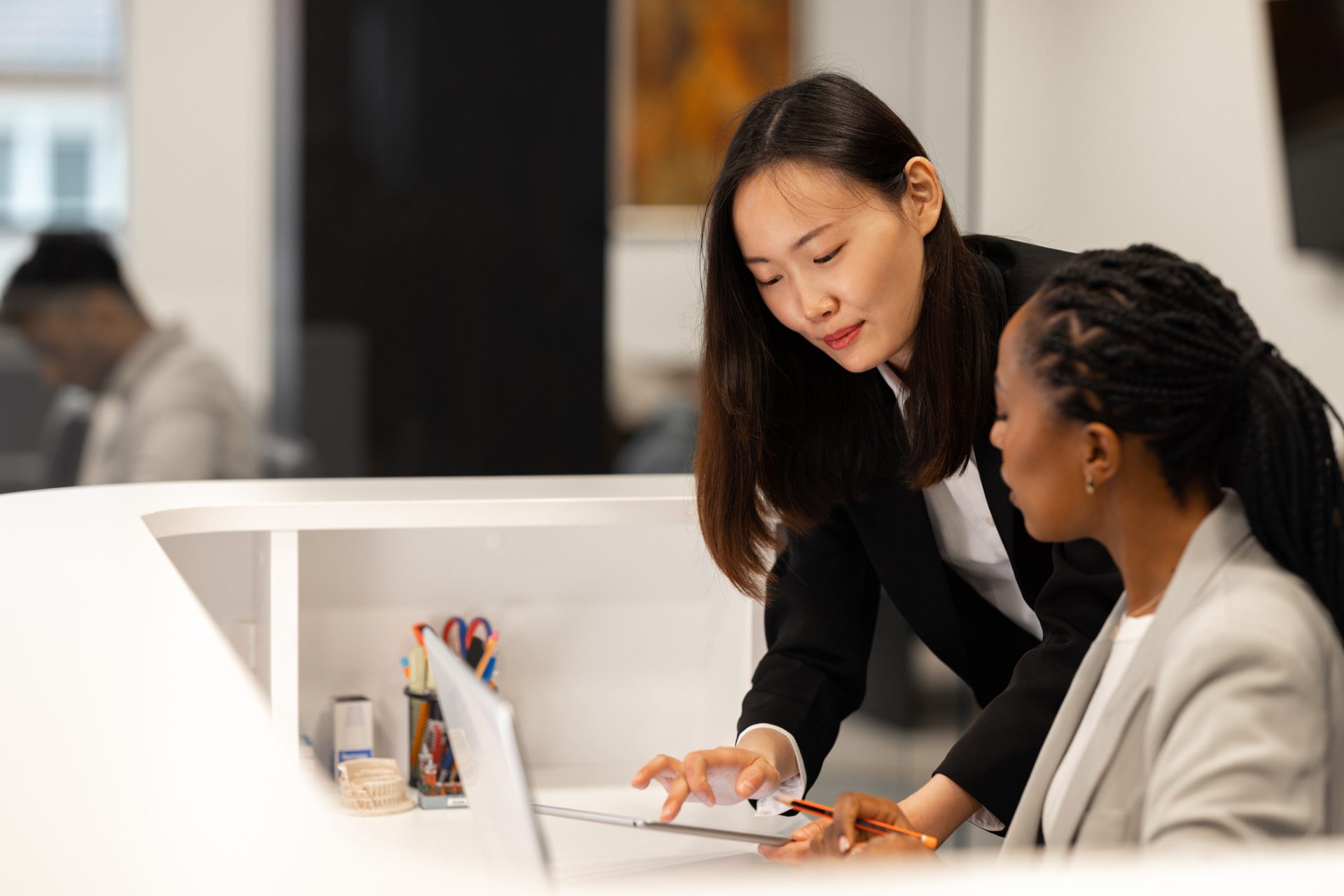 Banking, financial services and insurance operations specialists reviewing account data at a desk, representing BFSI outsourcing to the Philippines