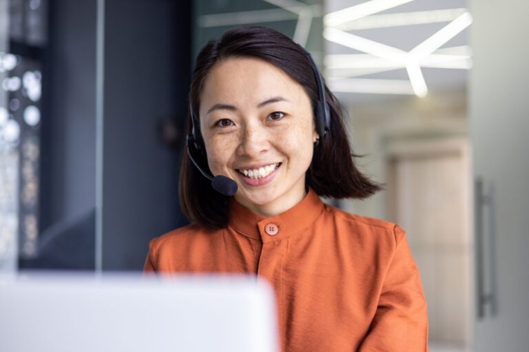 Utility service agent with a headset handling a billing call, for a post on utility customer program enrollment support