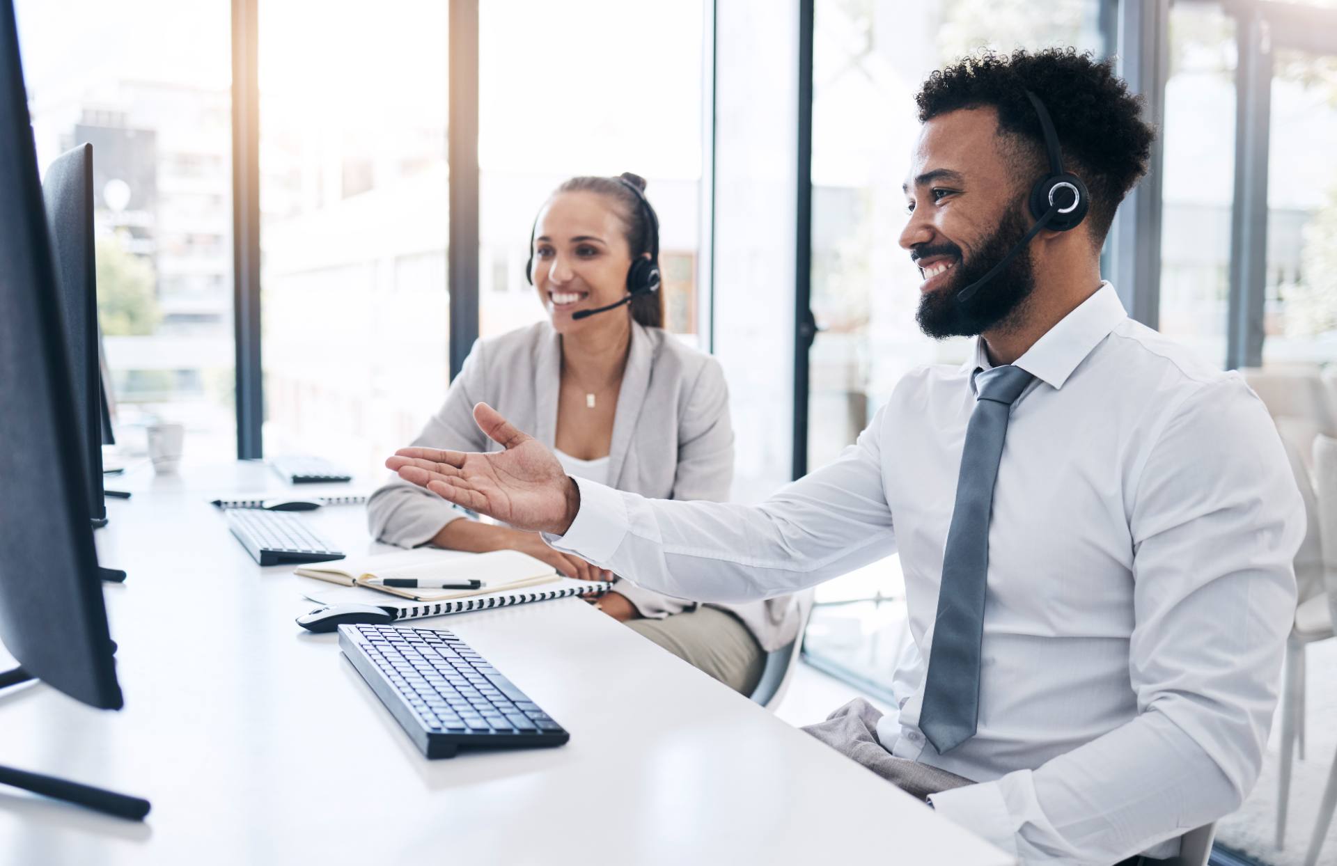 Insurance customer service agents with headsets assisting policyholders at a Philippine BPO