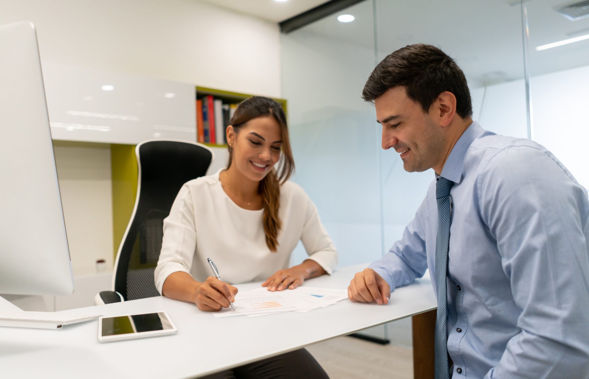 Financial crime analysts reviewing customer onboarding documents at a desk, representing KYC and AML operations outsourcing to the Philippines