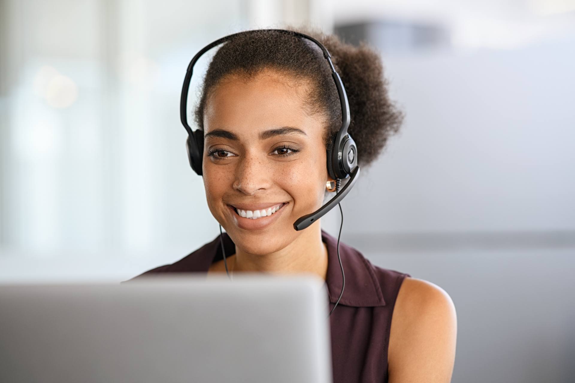Multilingual call center agent with headset assisting customers at a Philippine BPO